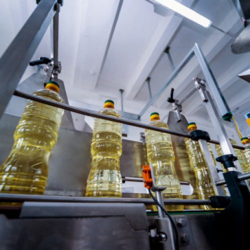 bottling-line-sunflower-oil-bottles-vegetable-oil-production-plant-high-technology_179755-2121